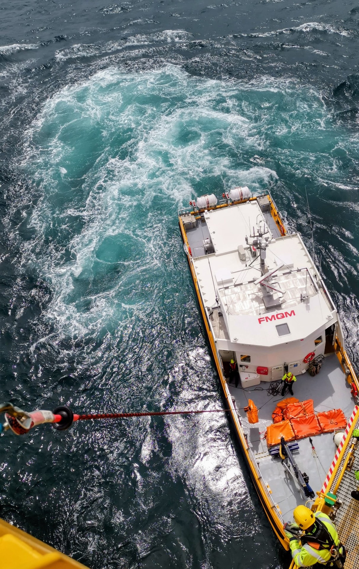 CTV manoeuvring against turbine boat landing