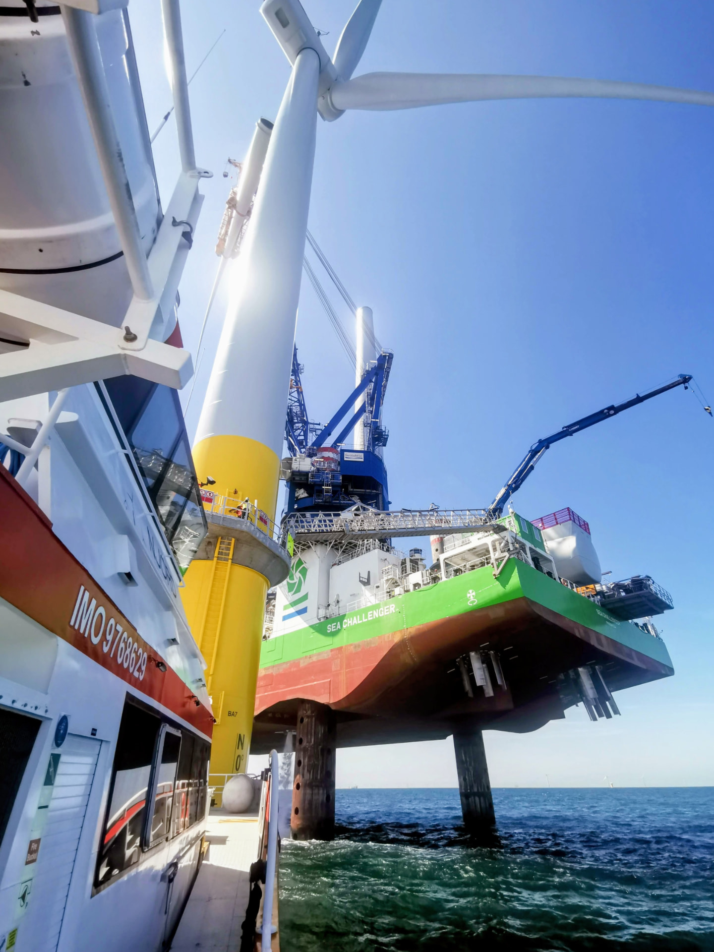 Jack-up installation vessel alongside an offshore wind turbine foundation