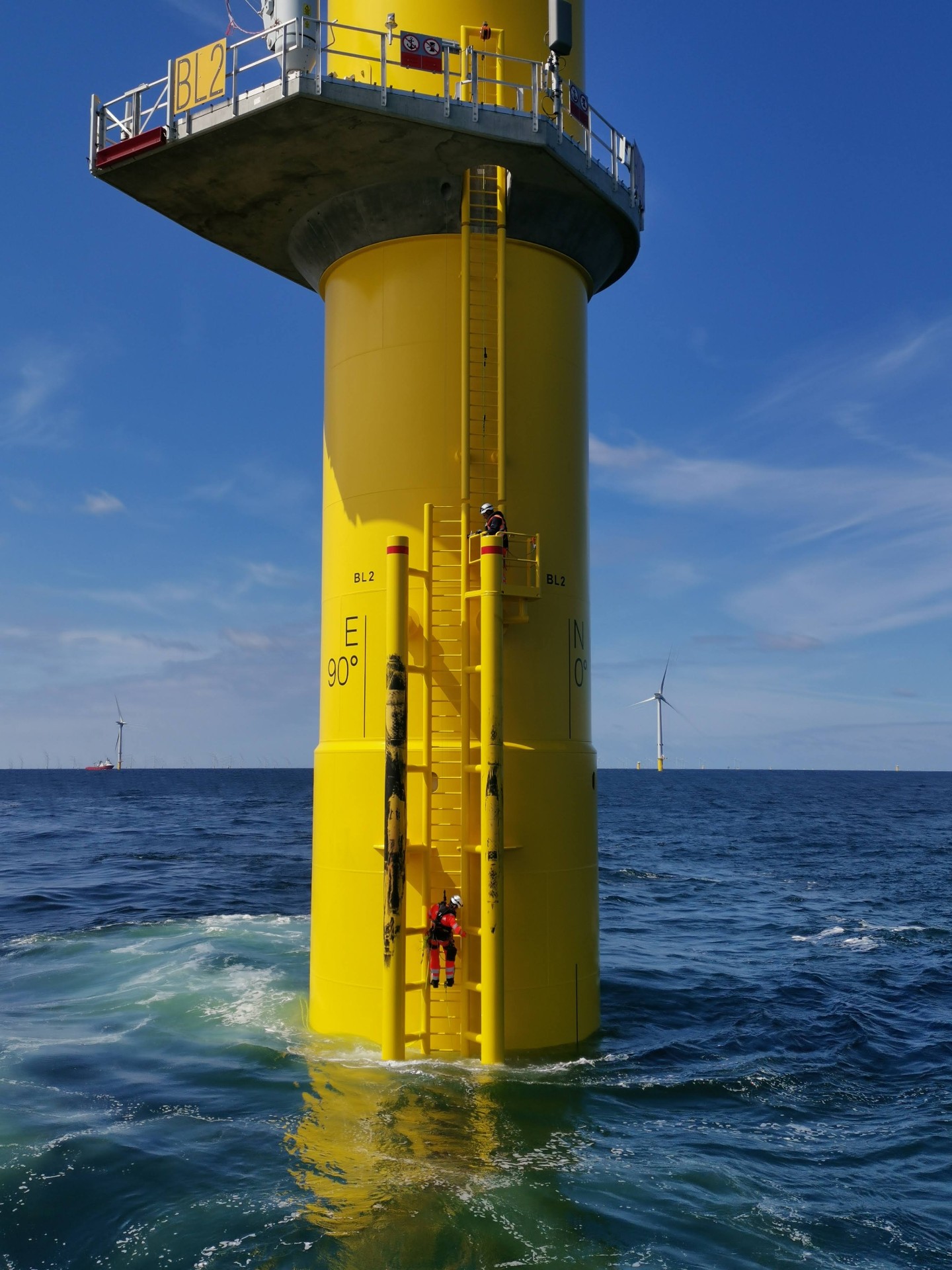 Offshore wind technician working on turbine secondary steel